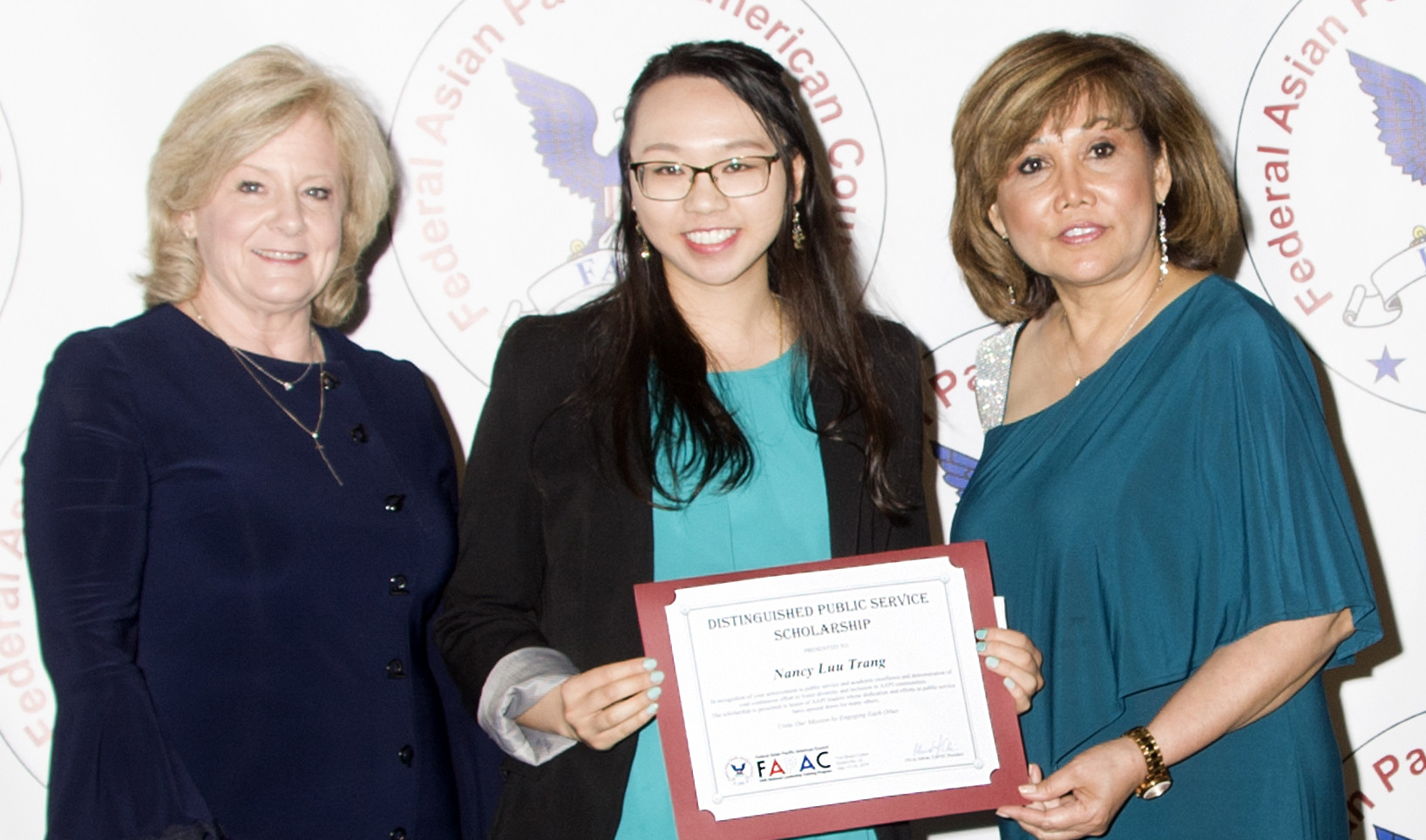 Nancy Trang (Center) with Marshall Space Flight Center Director Jody Singer (left) and FAPAC President Olivia Adrian (right)